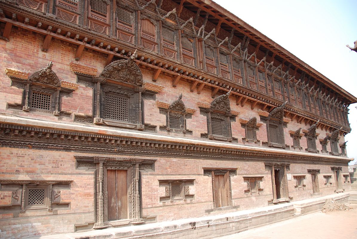 Kathmandu Bhaktapur 03-1 Bhaktapur Durbar Square Palace Of 55 Windows The Palace of 55 Windows in Bhaktapurs Durbar Square is actually the east wing of the Royal Palace, constructed in the 17C of red brick and featuring 55 black, artfully-carved wooden windows.